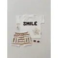 KOMPLET T-SHIRT ,,SMILE’’ECRU + SZORTY STRIPS LATTE